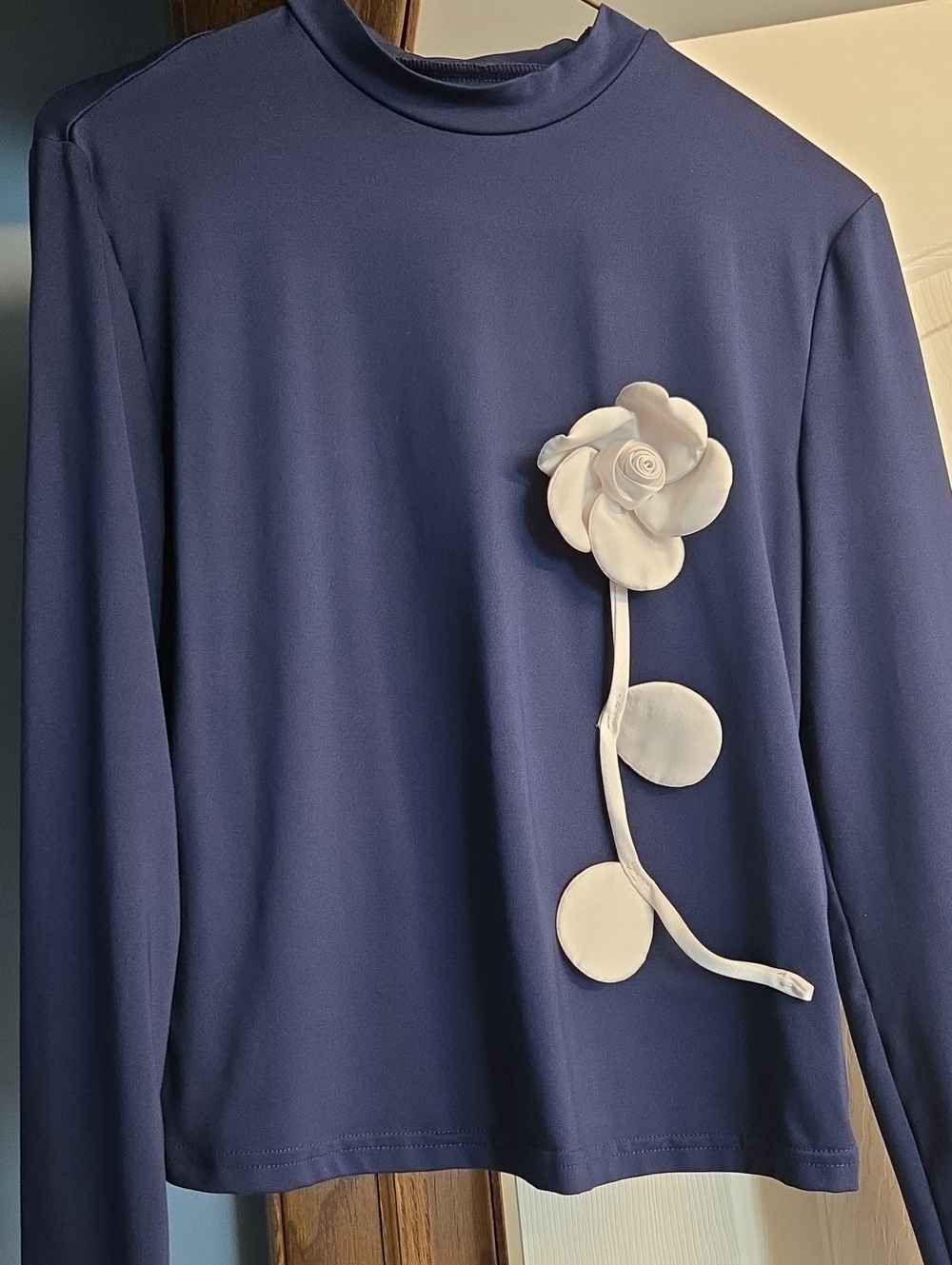 Navy Long-Sleeve Mock Neck Top with White Floral Applique